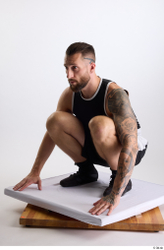 Whole Body Man White Sports Shorts Slim Athletic Kneeling Top Studio photo references